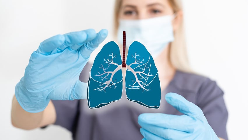 nurse holding lungs symbol